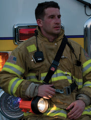 Firefighter carrying a Streamlight Fire Vulcan LED lantern on its shoulder strap