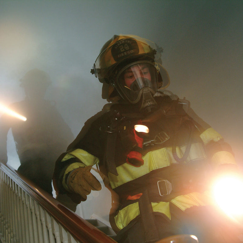 Firefighter wearing a Streamlight Survivor LED light on turnout gear