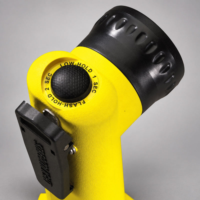Yellow Streamlight Survivor LED light showing push-button switch and gear clip