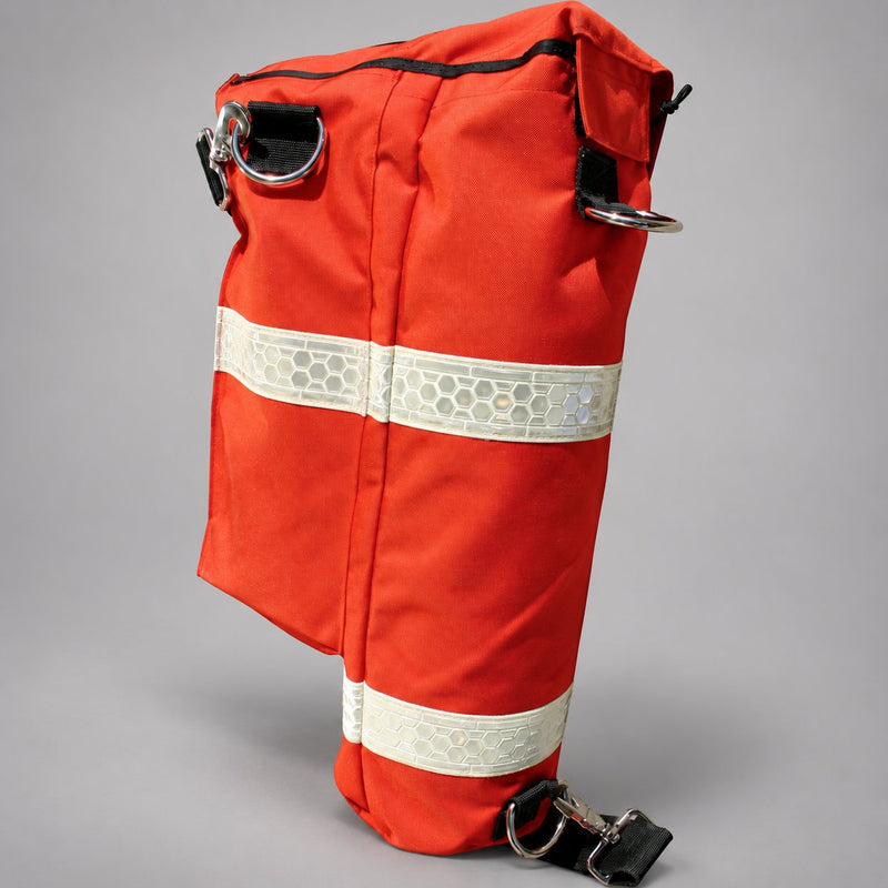 Upright orange Cascade RIT bag showing metal attachment rings, black webbing and reflective bands.
