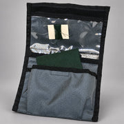 Open Strike Team clothing repair kit Cordura pouch showing green fabric, thread, and sewing needle