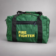 Green Strike Team forestry gear bag with black webbing handles, zippered side pocket and yellow FIRE FIGHTER lettering.