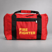 Red Strike Team forestry gear bag with black webbing handles, zippered side pocket and yellow FIRE FIGHTER lettering.