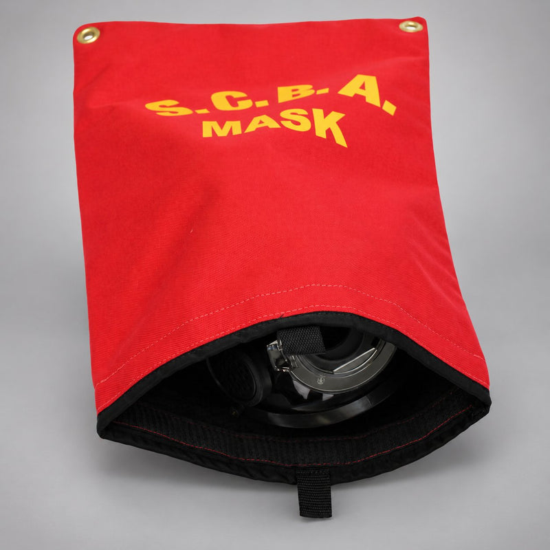Red SCBA mask bag with the bottom open, showing its black lining, pull tab and a face mask inside.