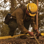 Wildland fire hose line tee valve installed in a hose lay