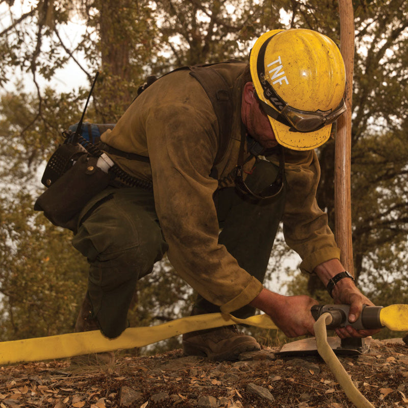 Wildland fire hose line tee valve installed in a hose lay